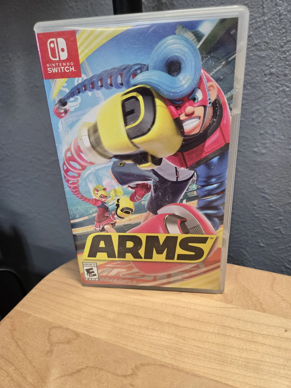 Nintendo ARMS Switch Game – Yellow, Blue & Pink Cover